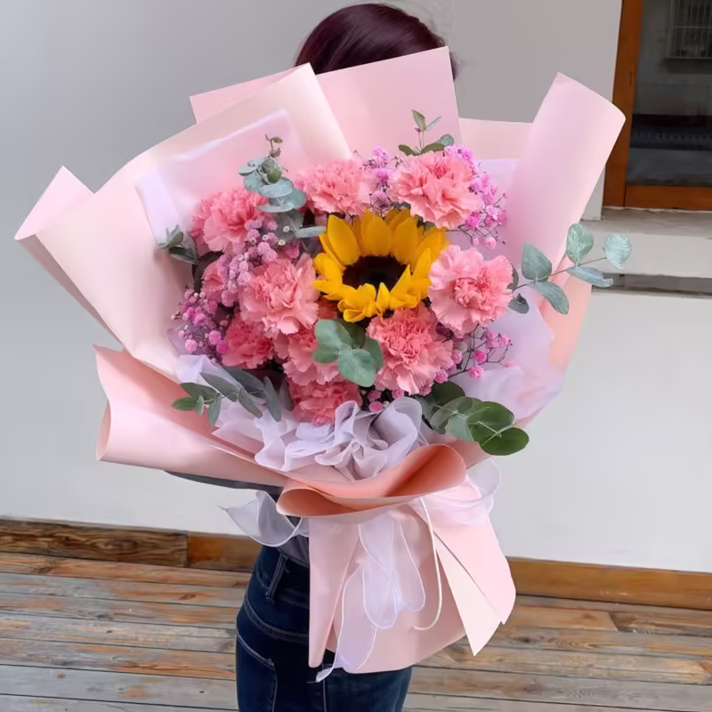 Sweet Charm: 11 Pink Carnations & Sunflower Bouquet