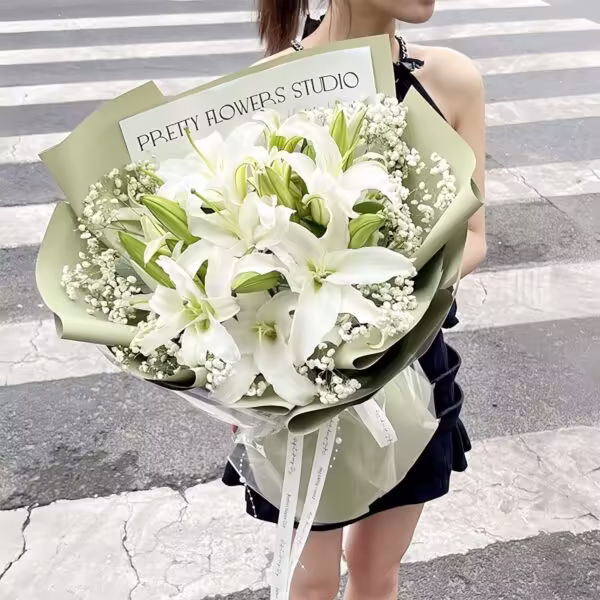 Bouquet di 11 Gigli Bianchi e Gypsophila: Momenti di Tenerezza